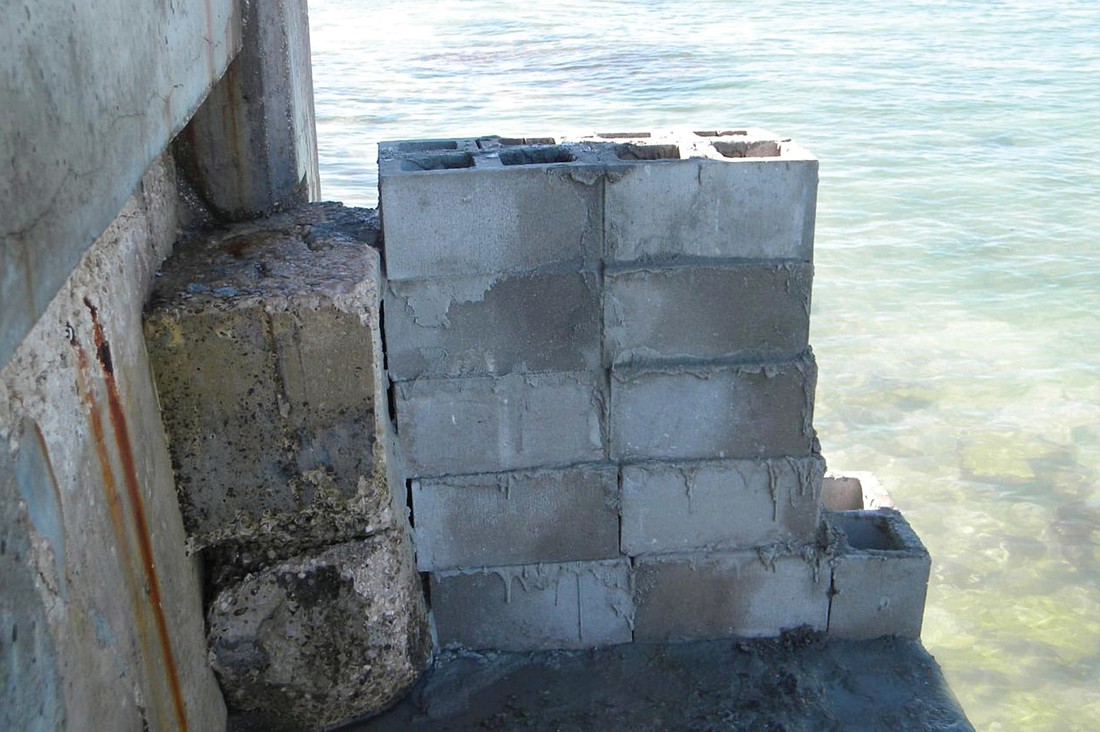 South Key residents were alarmed over the New YearÃ¢â‚¬â„¢s holiday when they saw residents building a concrete wall on top of a seawall at Point of Rocks Circle. The wall was removed after county staff intervened. Courtesy photos.