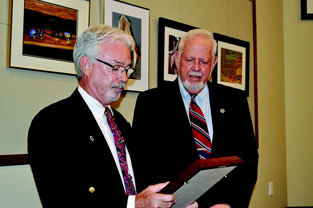 Mayor Jim Brown, pictured last year with outgoing Mayor George Spoll, took the mayor's seat last March.