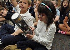Willis Elementary School first grade student Grace Haddock checks out an instrument used by the National Oceanic  and Atmospheric Administration when it sends crews to fly into hurricanes.