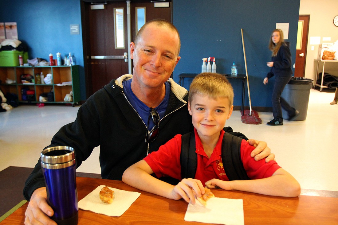 Hawk and Jade, 8, Holmes, Friday, Jan. 13, at Imagine School's "Donuts with Dad" event.