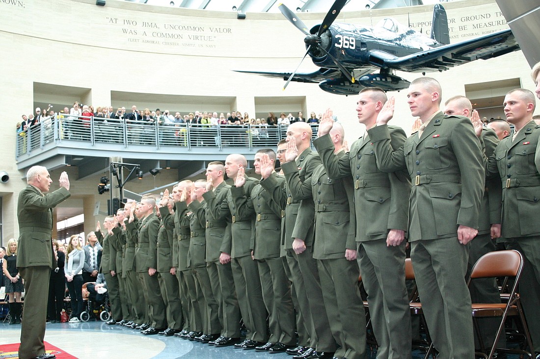 Newly commissioned USMC 2nd lieutenants take the oath of office at the National Museum of the Marine Corps at Quantico, Va. Courtesy.