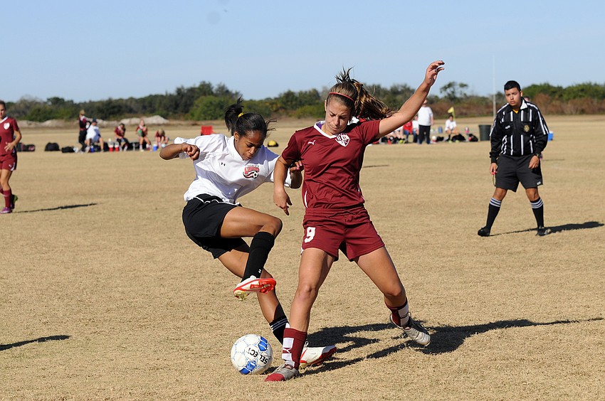Midfielder Maria Miller, 14, battles for position during the Braden River Soccer Clubâ€™s game versus the Ocala Lightning Elite Jan. 15.