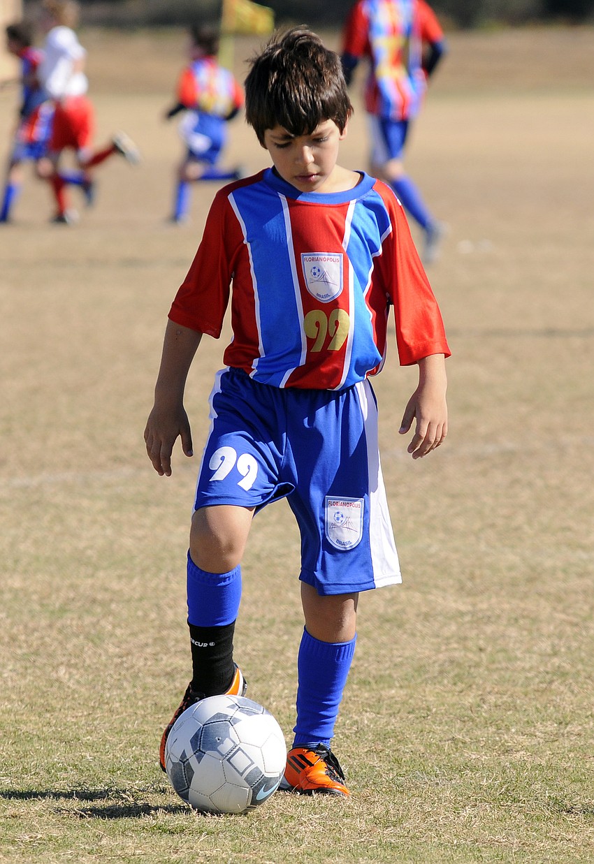Nine-year-old Matheus Scozluz and his teammates traveled from Brazil to compete in the USSSA Southeast Regional Championship.