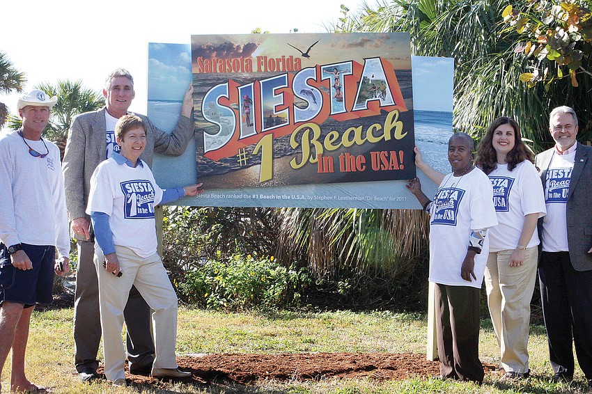 Lifeguard Scott Ruberg and County Commissioners Jon Thaxton, Nora Patterson, Carolyn Mason, Christine Robinson and Joe Barbetta