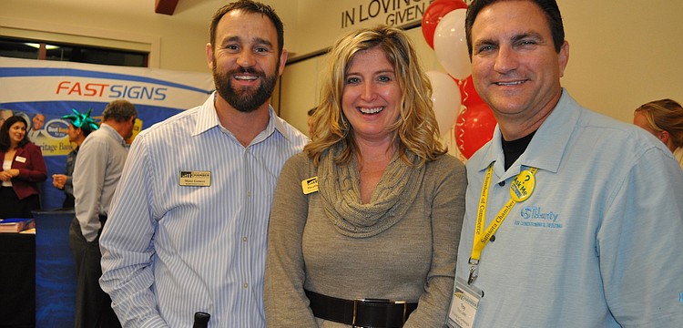 Matt Gower and Heather Kasten, of the Sarasota Chamber, with Troy Larkin, of Tri County Air Conditioning & Heating