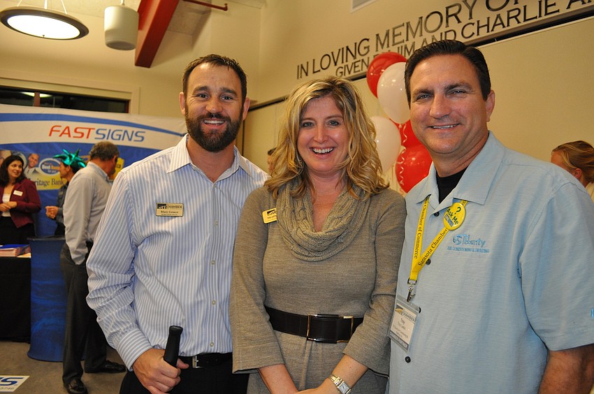 Matt Gower and Heather Kasten, of the Sarasota Chamber, with Troy Larkin, of Tri County Air Conditioning & Heating
