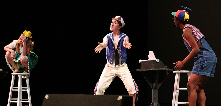 Sydney Deal, Matthew Robertson and Treyvon Thomas perform "Words, Words, Words", Thursday, Jan. 19, during Booker High Magnet Night for Visual and Performing Arts.