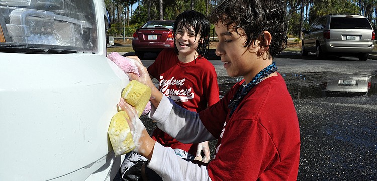 Fifth-graders Dylan Simmons and Anthony Jedrzejewski couldnâ€™t wait to wash the Manatee County Sheriffâ€™s Office vehicle that came through.