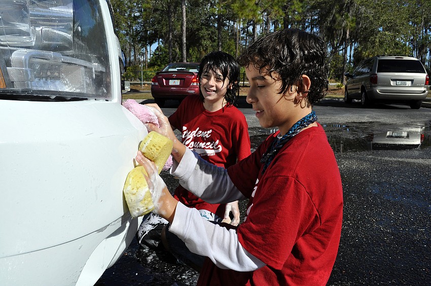 Fifth-graders Dylan Simmons and Anthony Jedrzejewski couldnâ€™t wait to wash the Manatee County Sheriffâ€™s Office vehicle that came through.