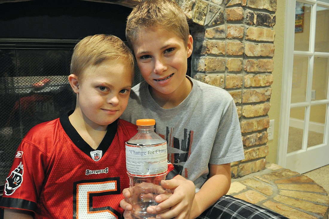 Matthew Baar, right, collected coins from friends and family to raise money for All ChildrenÃ¢â‚¬â„¢s Hospital, where his brother, Joey, left, received chemotherapy and other treatments for nearly four years.