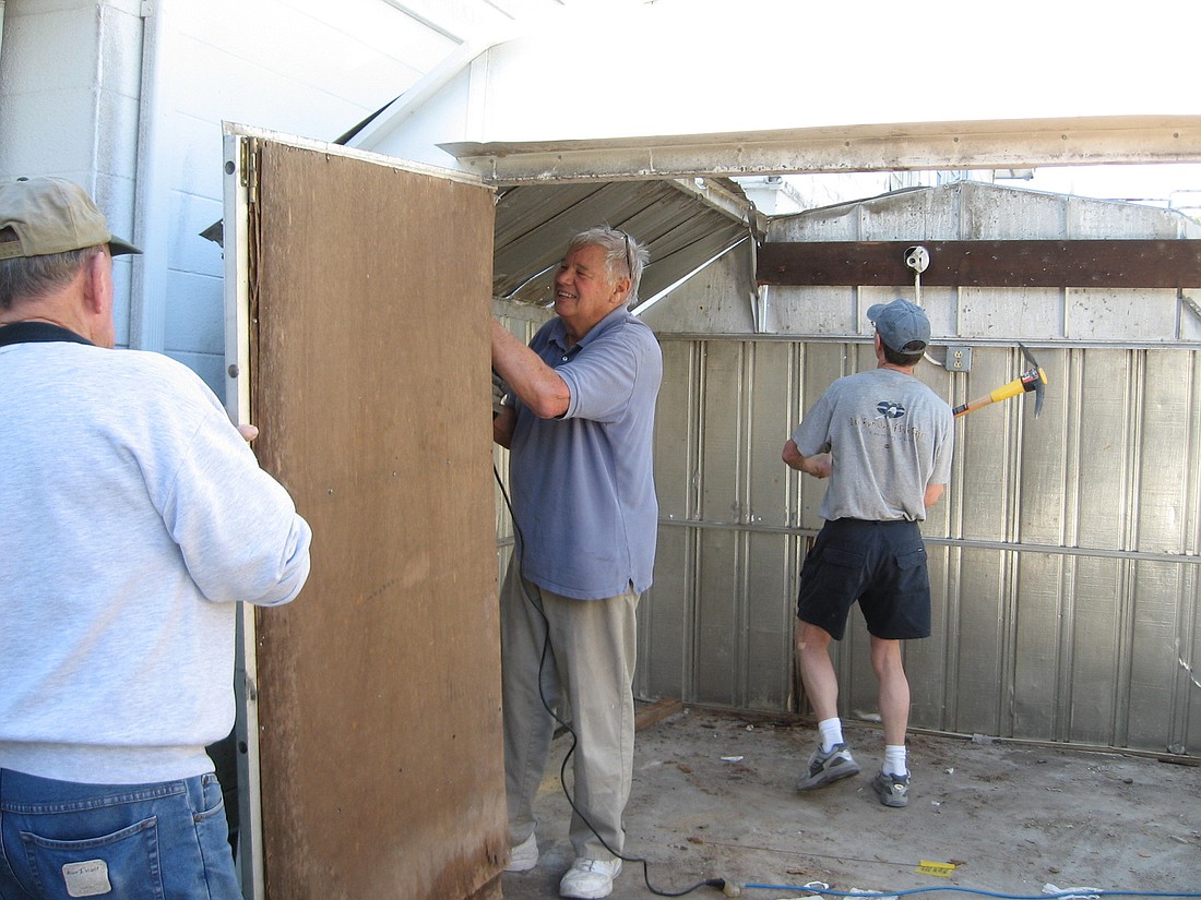 Board member John Holtzermann helps out with construction efforts. (Courtesy: Longboat Island Chapel)