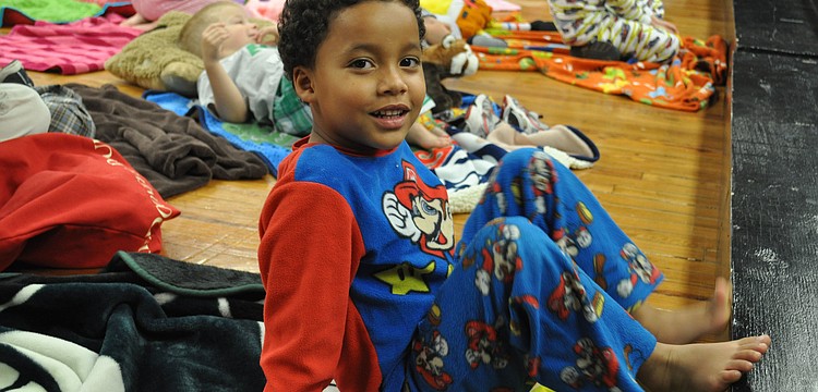 D.J. Rowley gets a close look at the play from the steps of the stage.