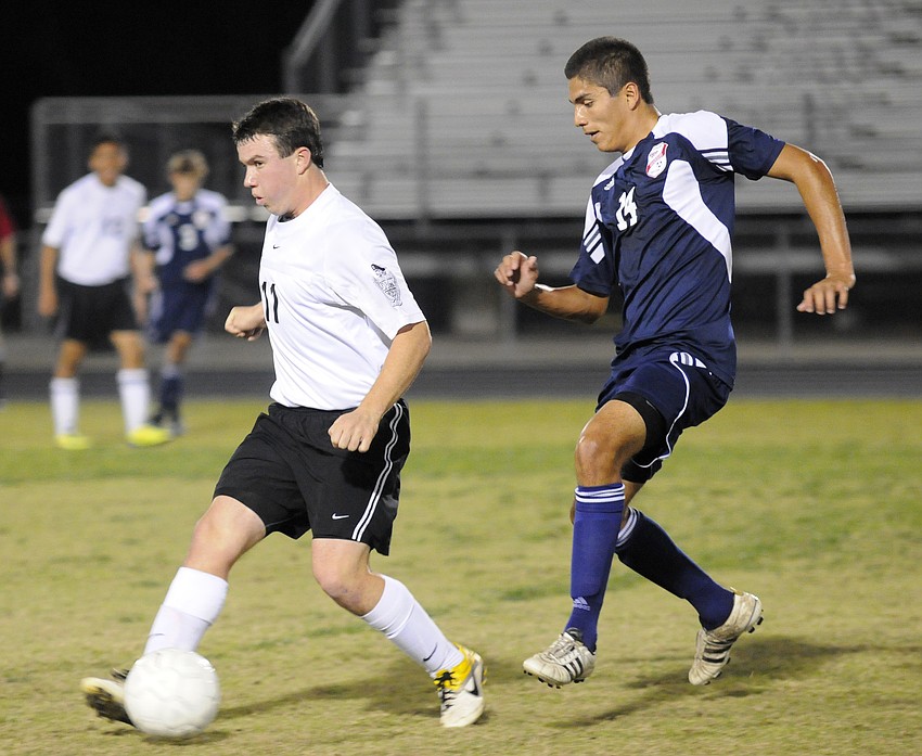 Braden River sophomore Danny Lane clears the midfield in search of an open teammate.