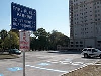 This parking lot in Burns Sqaure now offers free public parking.