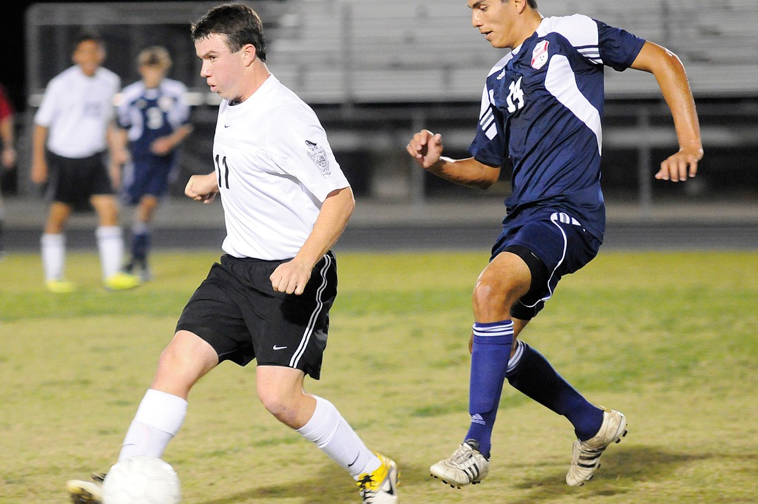 Braden River sophomore Danny Lane clears the midfield in search of an open teammate.