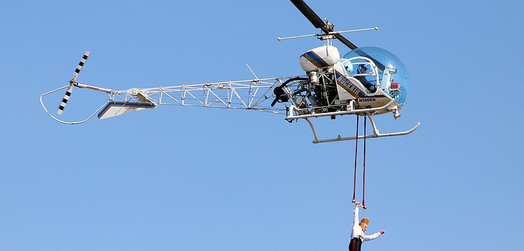Bello Nock did tricks on a trapeze attached to a helicopter from 500 feet up in the air, Thursday, Feb. 2, above the Circus Sarasota big top.