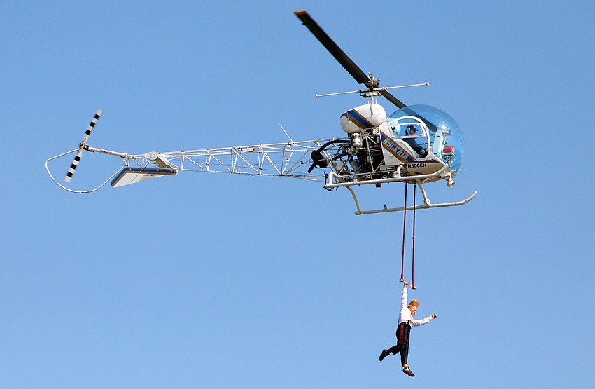 Bello Nock did tricks on a trapeze attached to a helicopter from 500 feet up in the air, Thursday, Feb. 2, above the Circus Sarasota big top.
