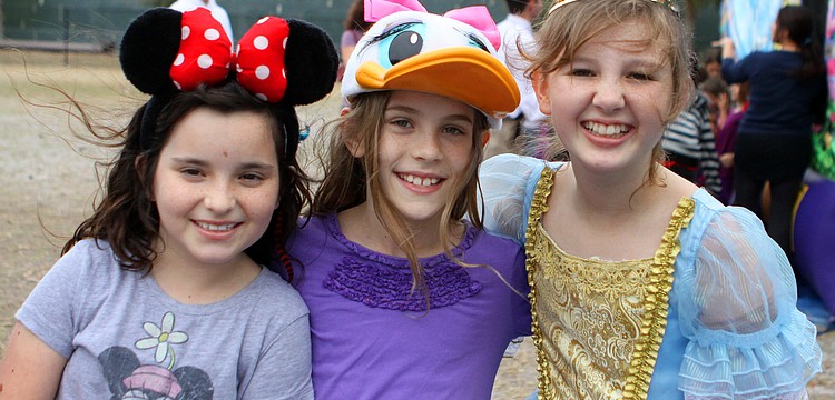 Lily Dougherty, 10, Lisa Larson, 9, and Madeleine Cooper, 10