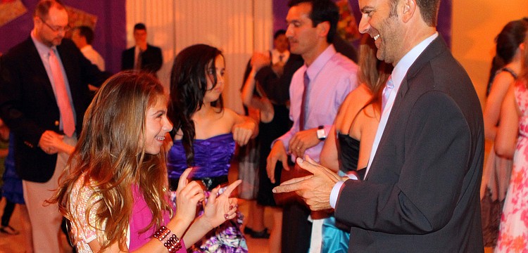 Isabella, 12, and Jon Cerrito show off their moves on the dance floor.