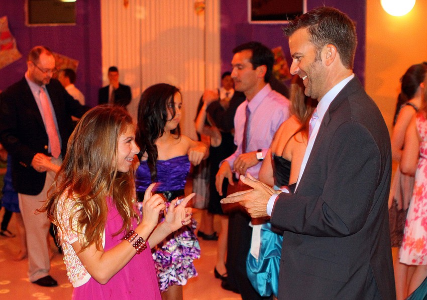 Isabella, 12, and Jon Cerrito show off their moves on the dance floor.
