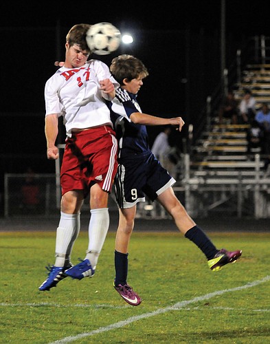 Indian Rocks Christian School's Chad Gessner and The Out-of-Door AcademyÃ¢â‚¬â„¢s Carson Jungers both attempt to head the ball.