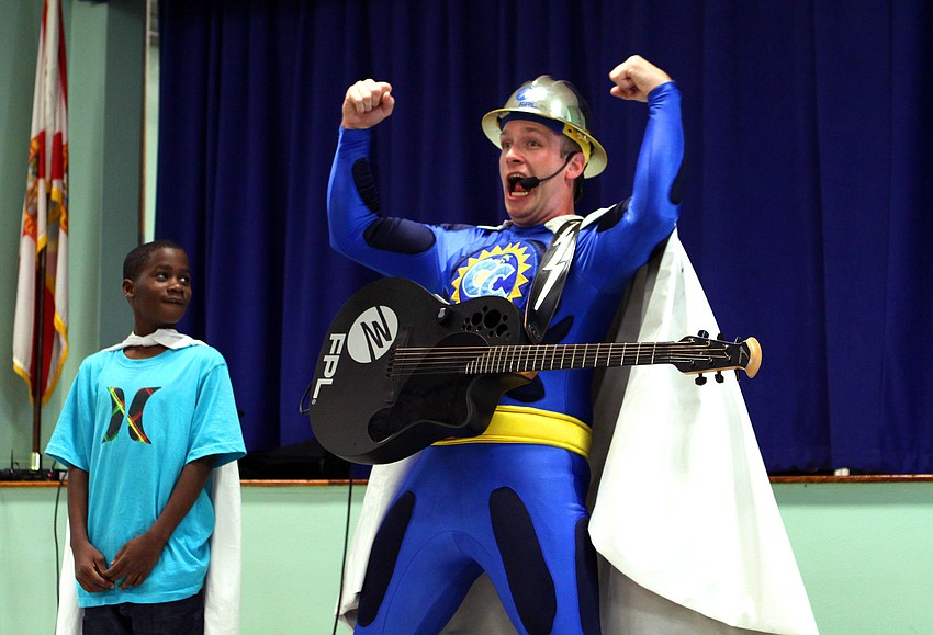 Captain Conservation shows off his superhero pose as Jordon King, 9, looks on, Wednesday, Feb. 8, at Bayhaven Elementary.