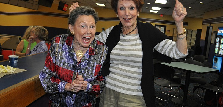 Geri Fisherkeller and Trude Smith cheer on their husbands