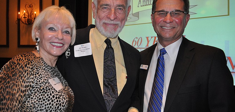 Elisabeth and Gil Waters with Gulf Coast Builders Xchange Chairman Lem Sharp