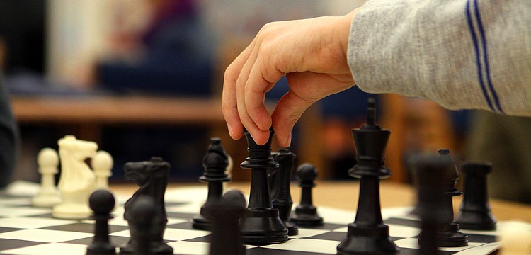 Noah Calcorzi moves his queen.