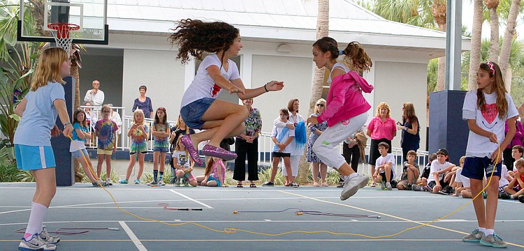 Lennon Isaac and Christy Wyatt jump while Alexis Hudson and Mary Ashley Fulton move the rope.