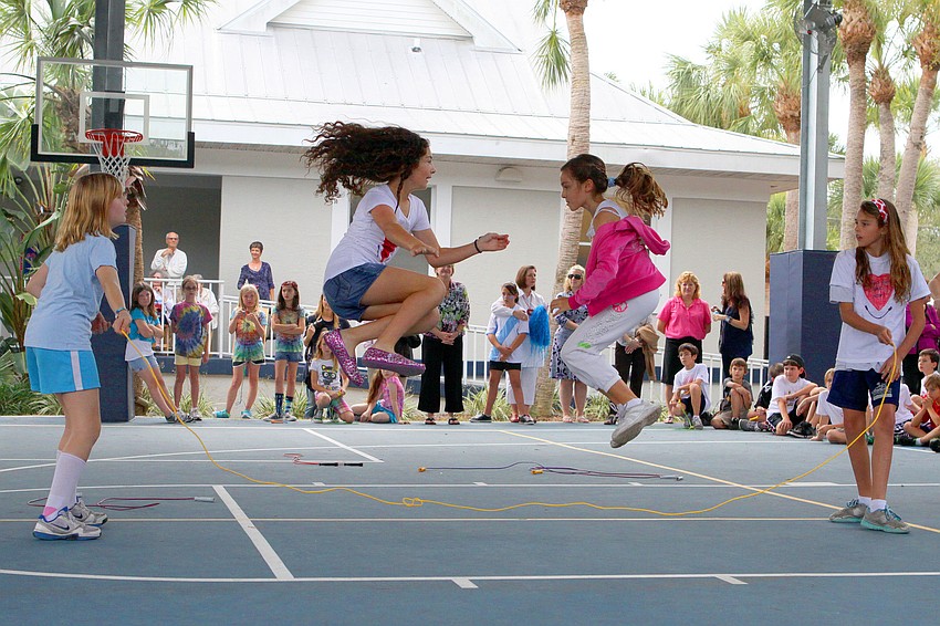 Lennon Isaac and Christy Wyatt jump while Alexis Hudson and Mary Ashley Fulton move the rope.