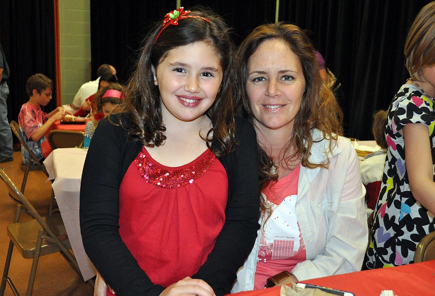 Eight-year-old Arianna Romano enjoyed a special Valentineâ€™s Day donut and milkshake with her mom Cindy.