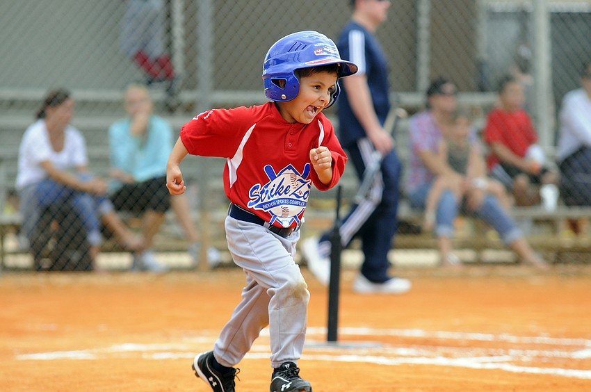 Four-year-old Troy Ingemi races down the first base line.