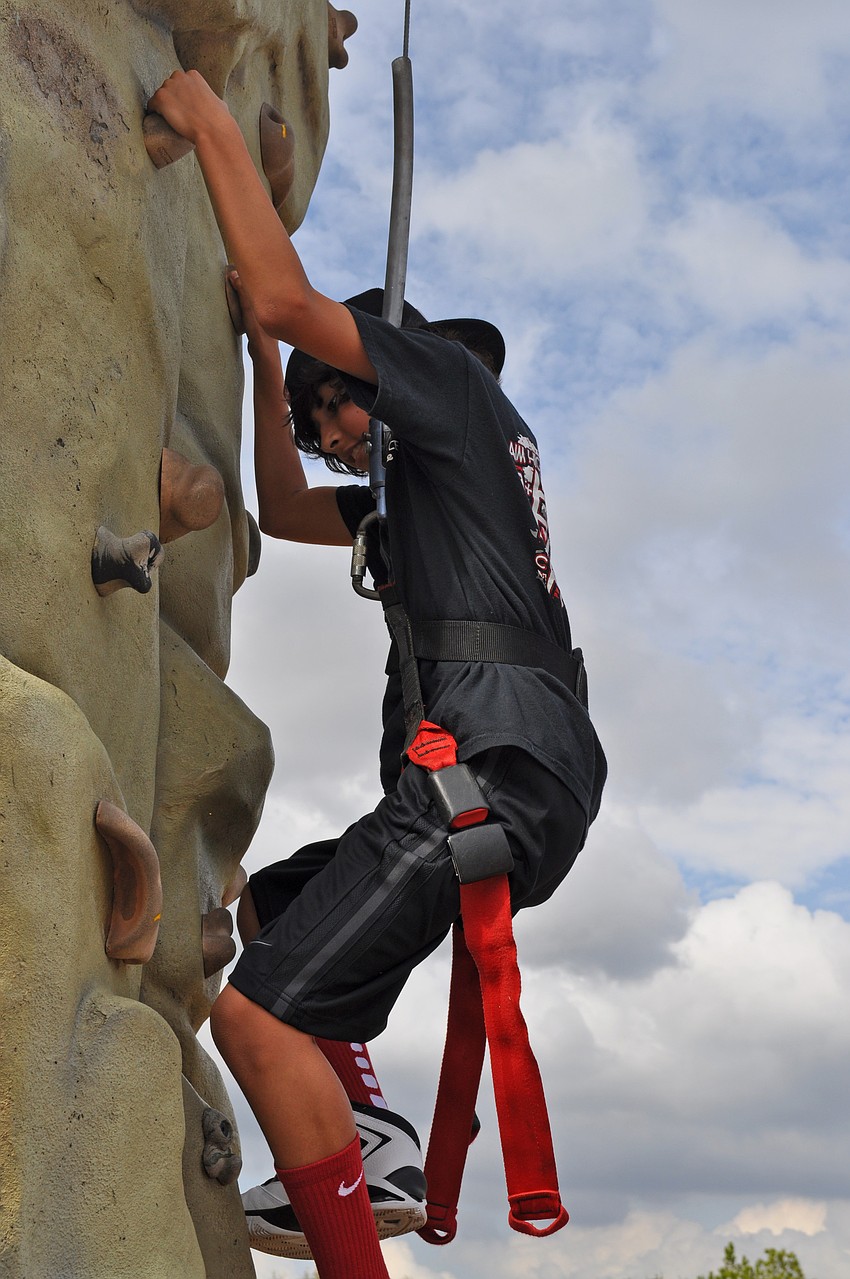 Twelve-year-old Michael Medina admitted the rock wall was harder than it looked.