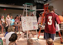 The 5th graders counted down from five before "The 7 Master Minds" Rube Goldberg project was set into motion.