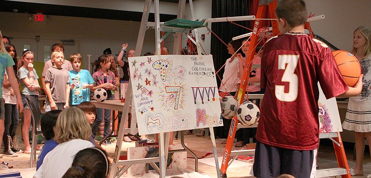 The 5th graders counted down from five before "The 7 Master Minds" Rube Goldberg project was set into motion.