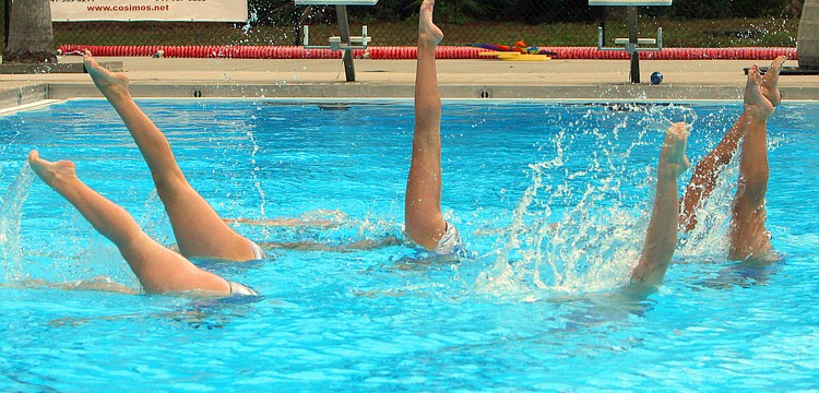 The 13-15 group performs one of their group acts, Sunday, Feb. 19, at the Selby Aquatics Center at the Sarasota Family YMCA.