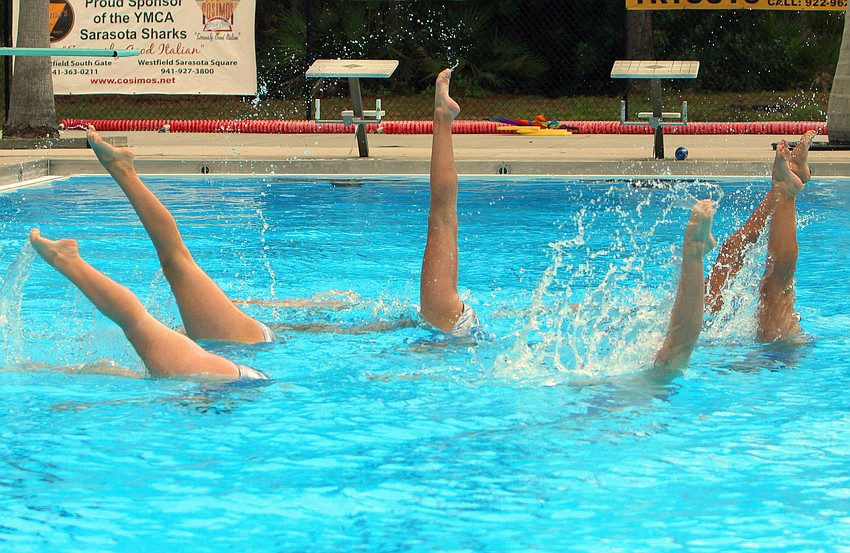 The 13-15 group performs one of their group acts, Sunday, Feb. 19, at the Selby Aquatics Center at the Sarasota Family YMCA.