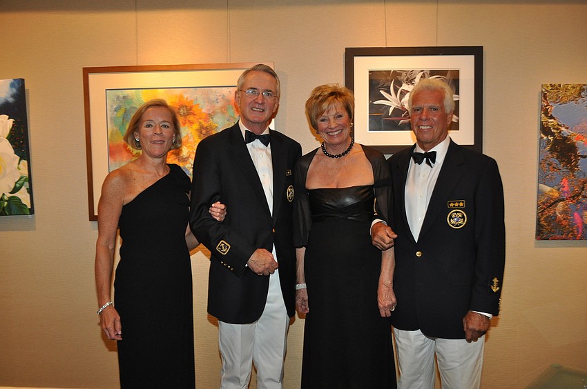 Marie and Incoming Commodore Bob Hunter and Carlene and outgoing Commodore Bob Baime