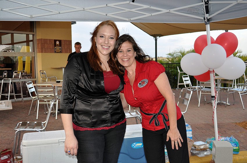 Jessica Ellermets and Rachel House of Sarasota Realty Team served refreshments at their booth.