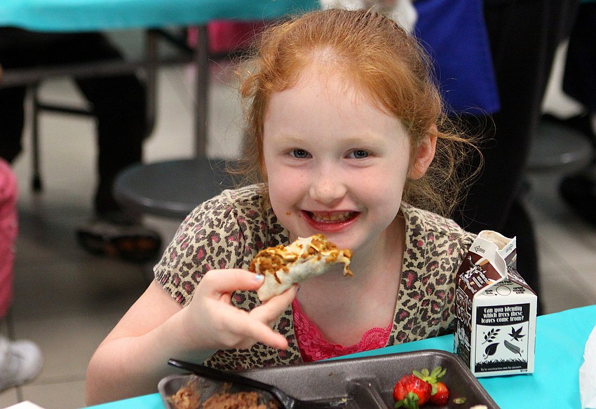 Abigail Schmitt, 6 1/2, enjoys her burrito, Thursday, Feb. 23, at El Restaurante Bay Haven.