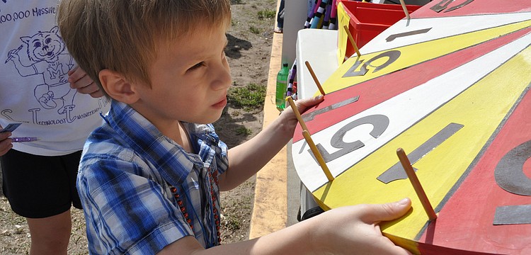 Nicholas Ortega, 4, spun the wheel for a prize.