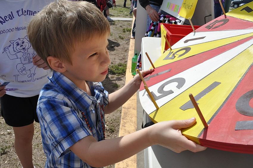 Nicholas Ortega, 4, spun the wheel for a prize.