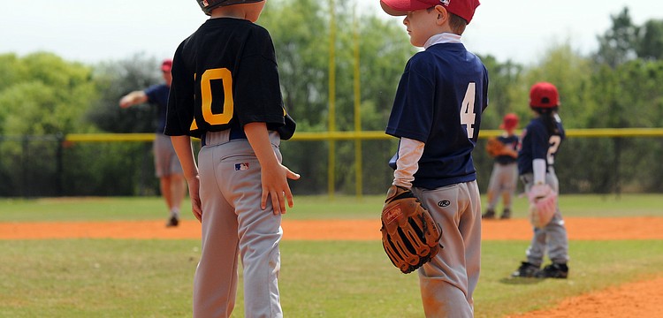Six-year-old Jake Schmidt and 5-year-old Zack Groth were excited to get the season underway.