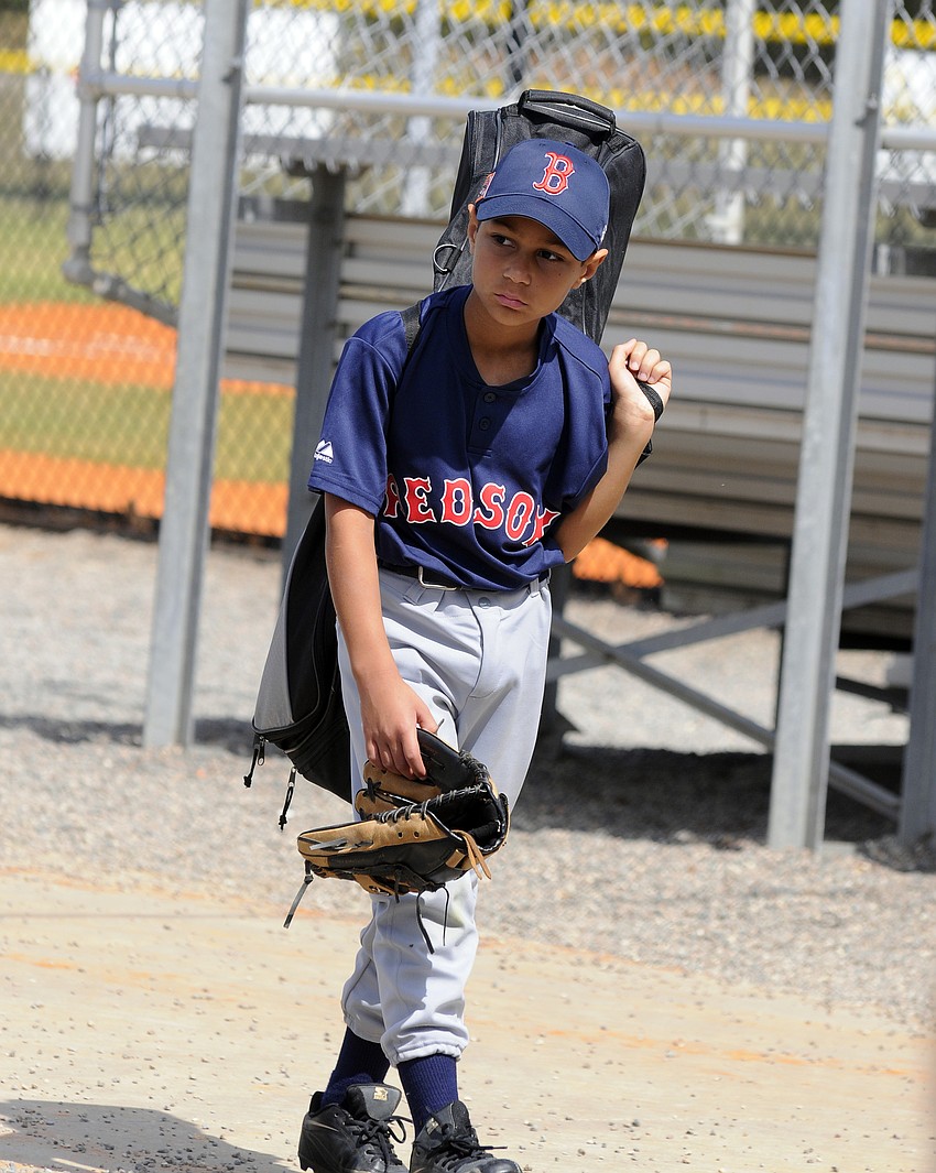Nine-year-old Jeremiah Keane plays for the Red Sox in the Minors division.