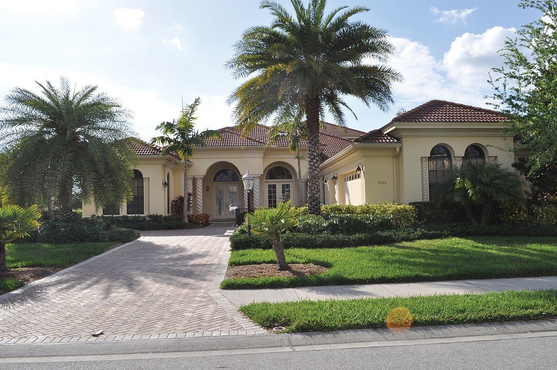 This Country Club of Lakewood Ranch home, which has five bedrooms, four baths, a pool and 4,789 square feet of living area, sold for $975,000. Photo by Jen Blanco