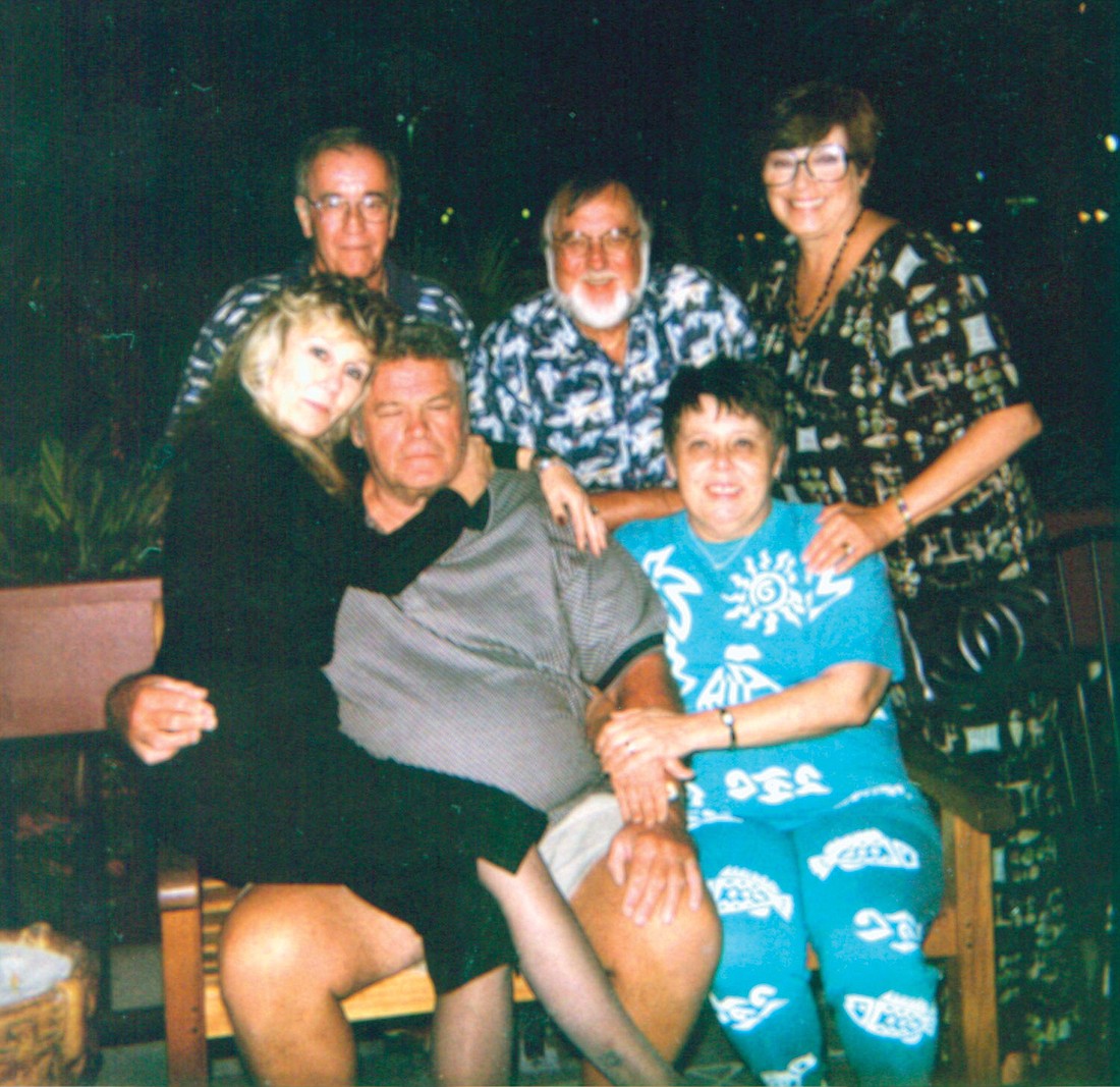 This is one of the only photos Anne Armour ever allowed us to print of her. Anne, seated at right, surrounded by friends and family, circa 2000.