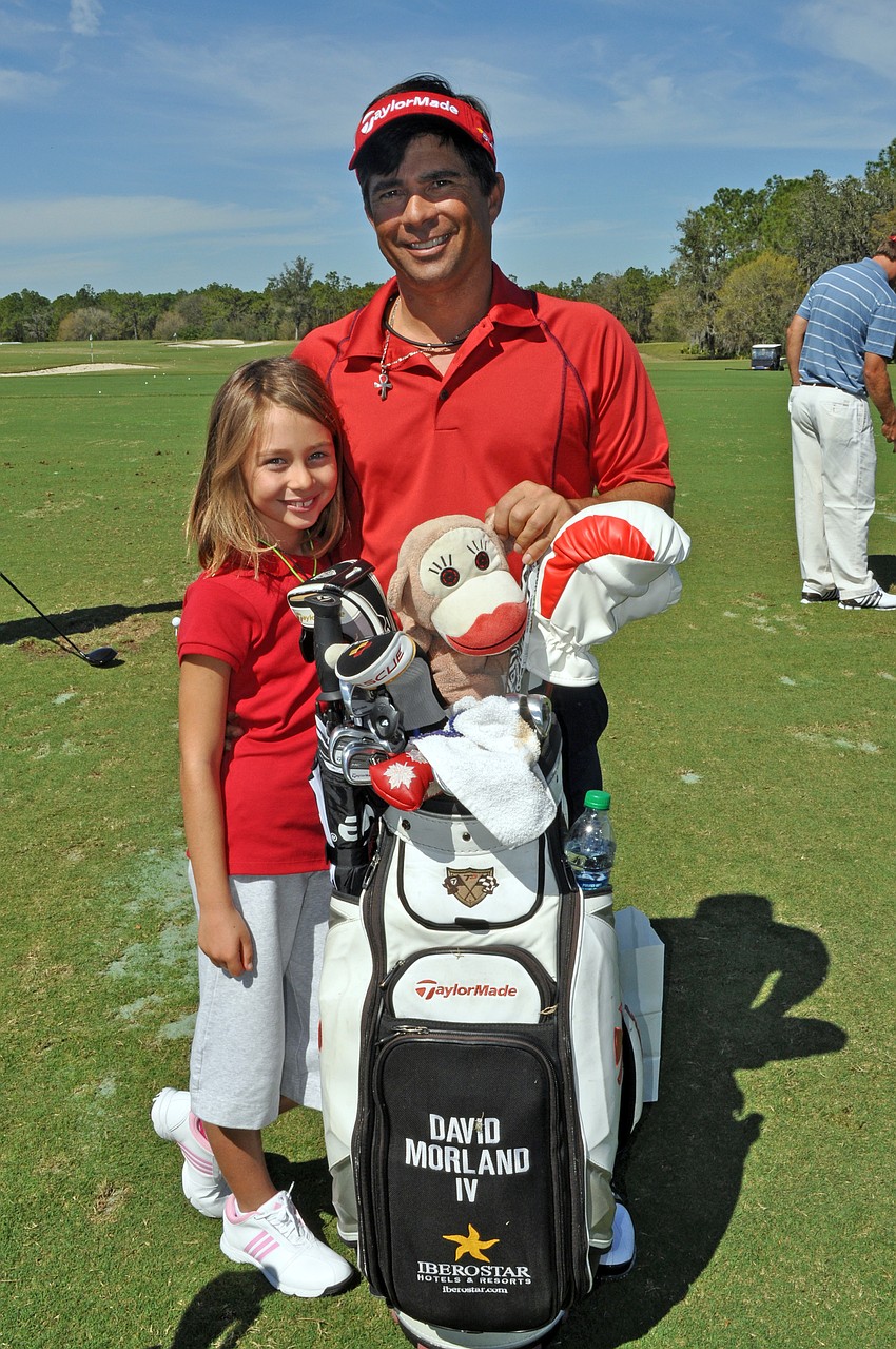 Professional golfer David Morland IV brought his 8-year-old daughter Taylor to the tournament.