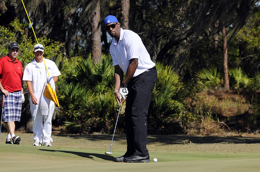 Detroit Lions wide receiver Calvin Johnson putts during the second day of the tournament.