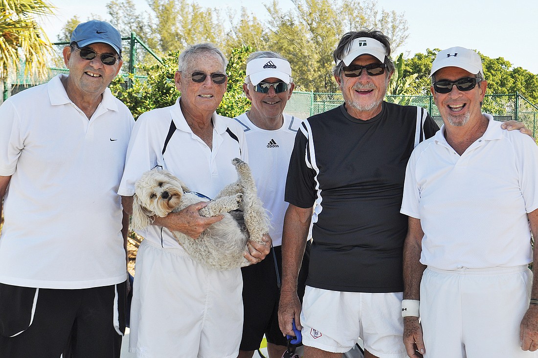 Some of the men from the Wednesday morning tennis group pal around with their mascot, Racket: Frank Quiriconi, Bob Coyne, Steve Clark, Larry Straff and Larry Coleman.